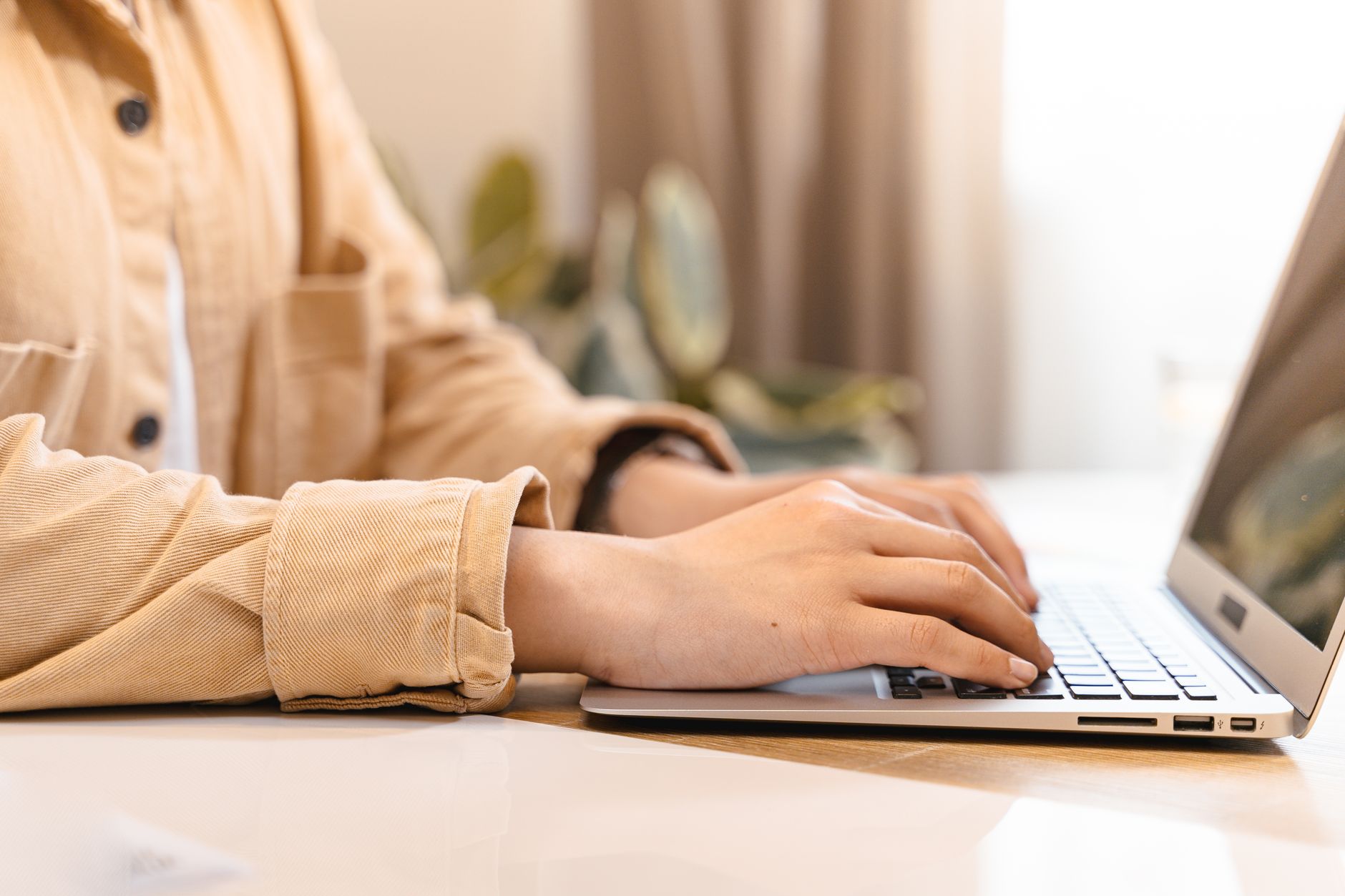 a person creating an n8n cloud account on a laptop screen