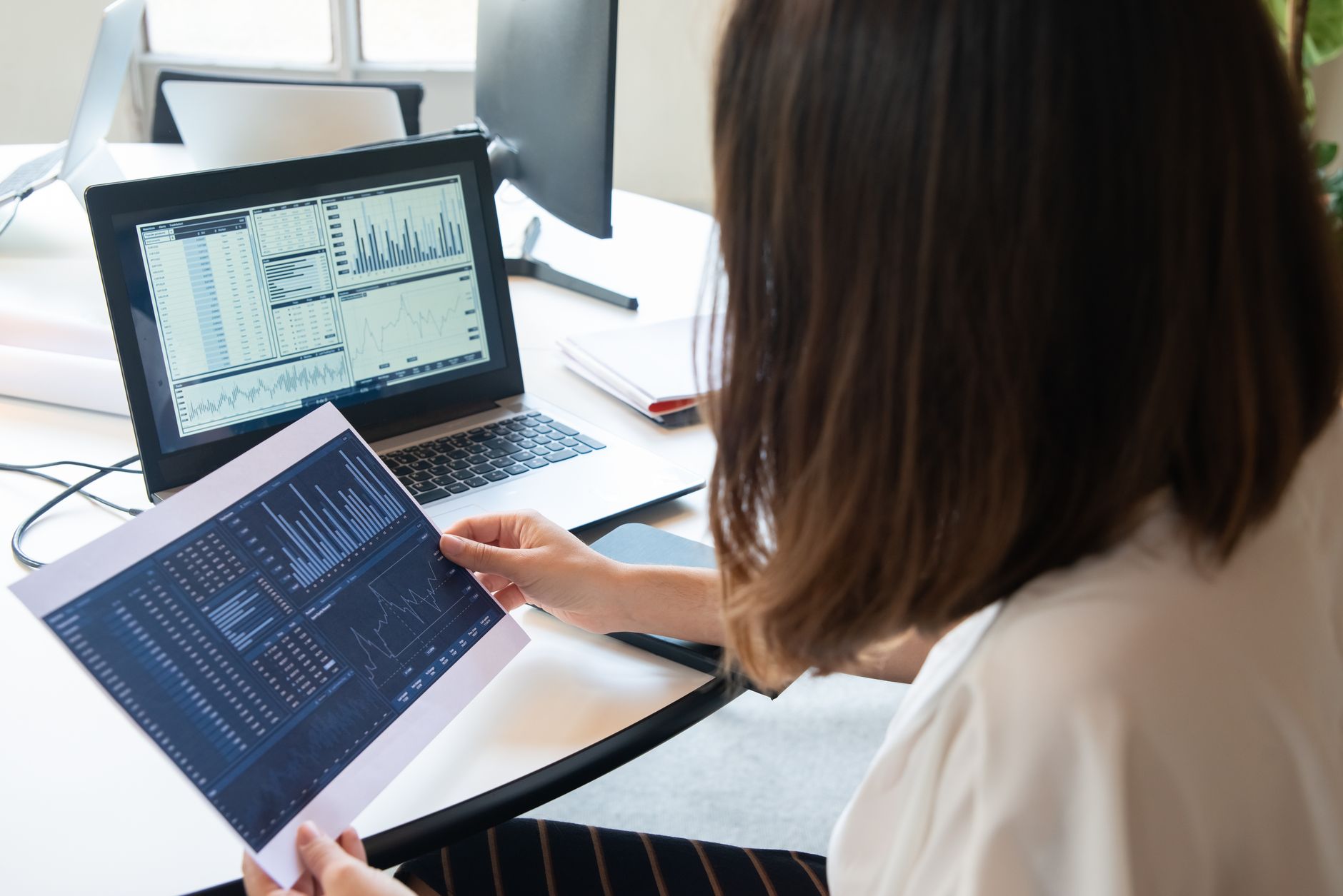 Freelancer viewing enriched lead records in a CRM dashboard on a laptop