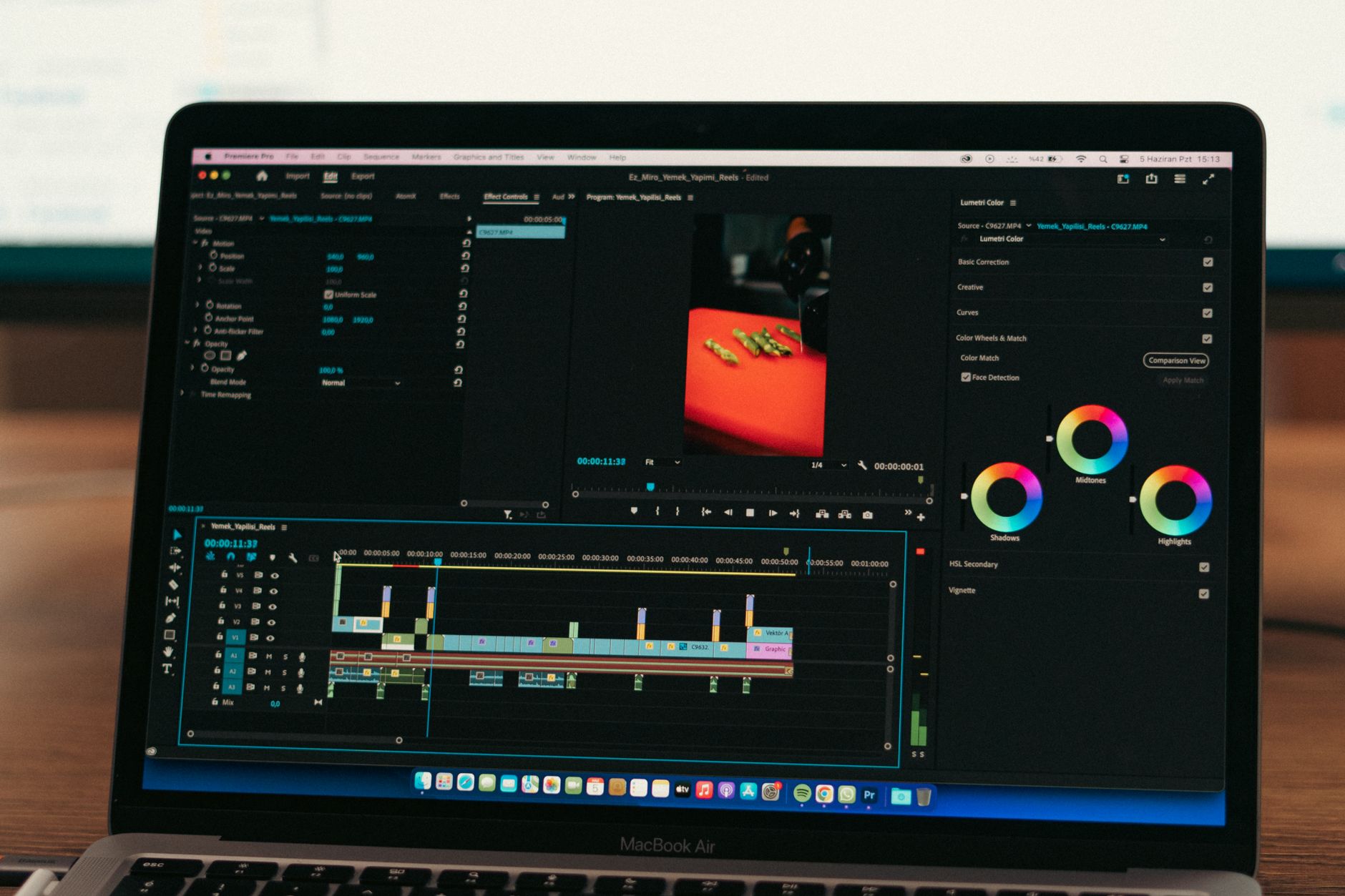 Laptop screen showing colorful workflow automation builder with connected nodes and data paths